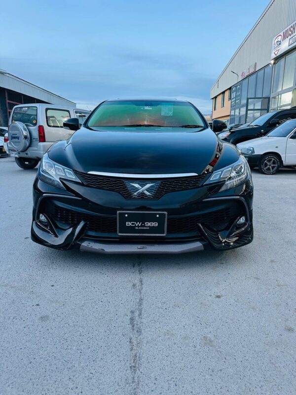 Toyota Mark X – Black Edition Mushtarka Motors Showroom 📅 Model Year: 2012 – 2019 (Example: 2016) 🎨 Color: Attitude Black Mica ⚙️ Engine Type: 2.5L V6 (4GR-FSE) / 3.5L V6 (2GR-FSE) 🔄 Transmission: 6-Speed Automatic with Paddle Shifters ⛽ Fuel Type: Petrol 📍 Registration City: Karachi / Islamabad / Lahore / NCP 📏 Mileage: 40,000 – 85,000 km 🪑 Interior: Black / Beige Leather Upholstery Electric & Heated Seats Wooden Trim + Soft-Touch Dashboard Steering Wheel Controls Smart Key + Push Start ☀️ Sunroof: Yes (Electric Tilt & Slide) ❄️ Climate Control: Dual-Zone Automatic 🔈 Infotainment System: Touchscreen Multimedia Display Navigation + Bluetooth + Reverse Camera Premium Sound System 🚗 Drive Type: Rear Wheel Drive (RWD) 💡 Headlights: HID Projectors with LED DRLs 🛞 Wheels: 17/18-inch Alloy Rims with Low Profile Tyres 🧭 Safety Features: ABS + EBD + Traction Control Airbags (Driver + Passenger + Curtain) Cruise Control Rear Camera + Parking Sensors 🧾 Condition: Showroom maintained, scratchless exterior, smooth suspension, excellent engine performance, and clean luxury interior.